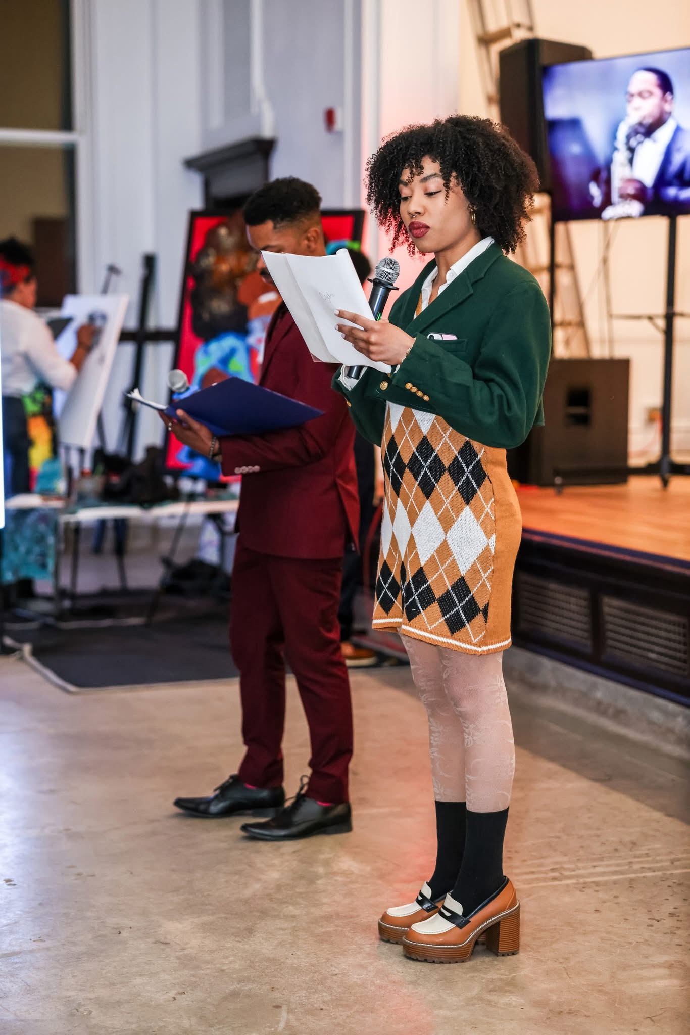 Spoken word performance at Reclaiming the Canvas